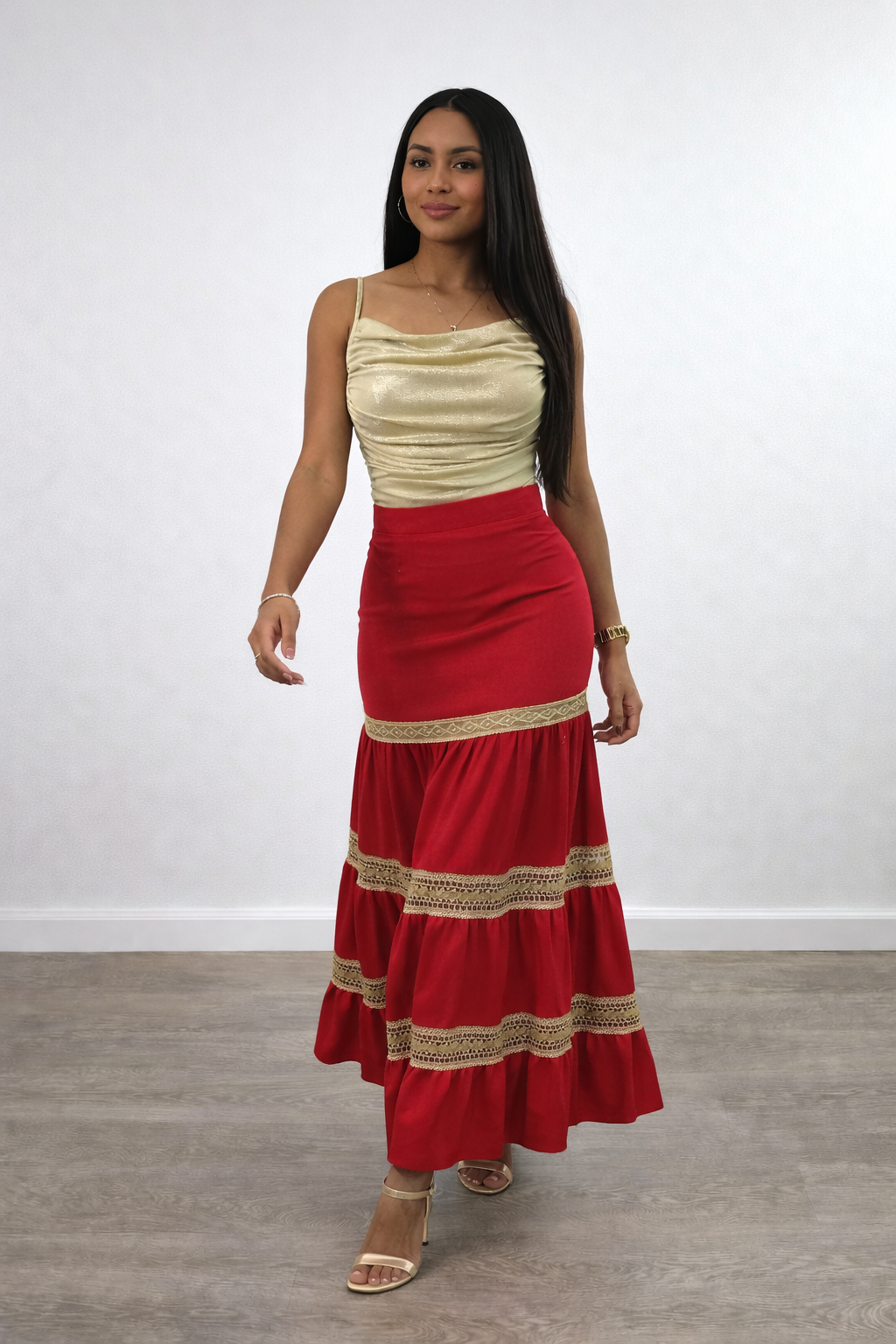 High-waisted red maxi skirt with tiered panels and lace trim detailing. A feminine boho skirt ideal for casual days, holidays, or evenings.