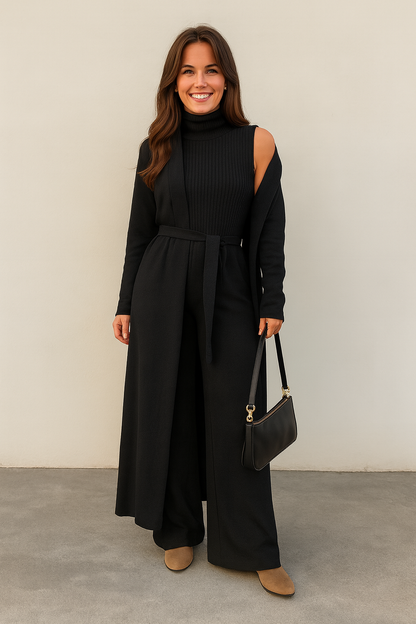 Woman wearing a black outfit with a plain background